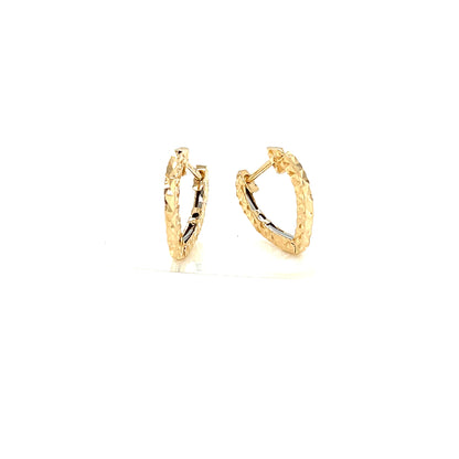 Heart shape Gold hoop earrings on a white background