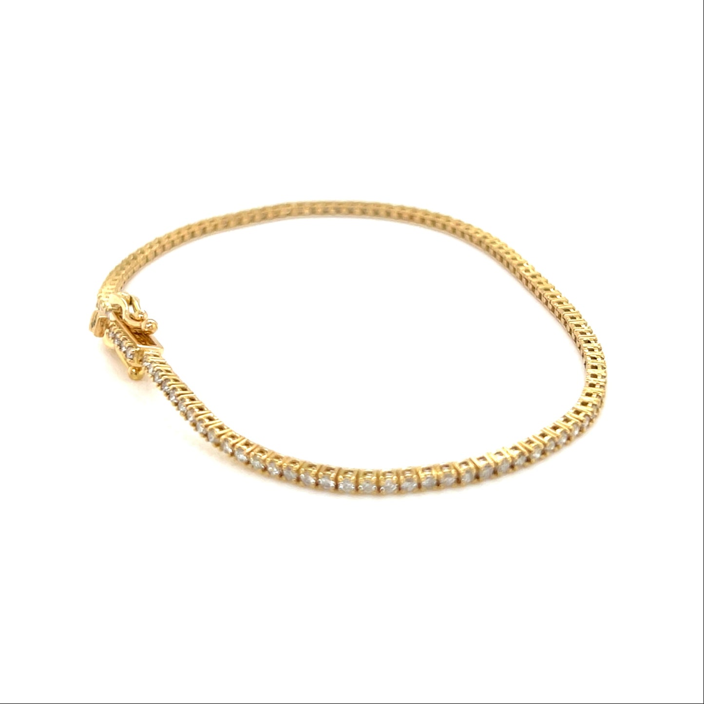 Gold bracelet with small diamonds on a white background