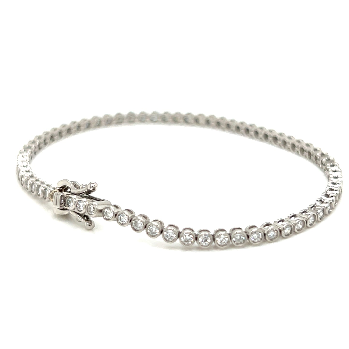 Silver bracelet with clear stones on a white background