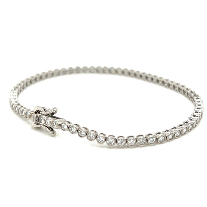 Silver bracelet with clear stones on a white background