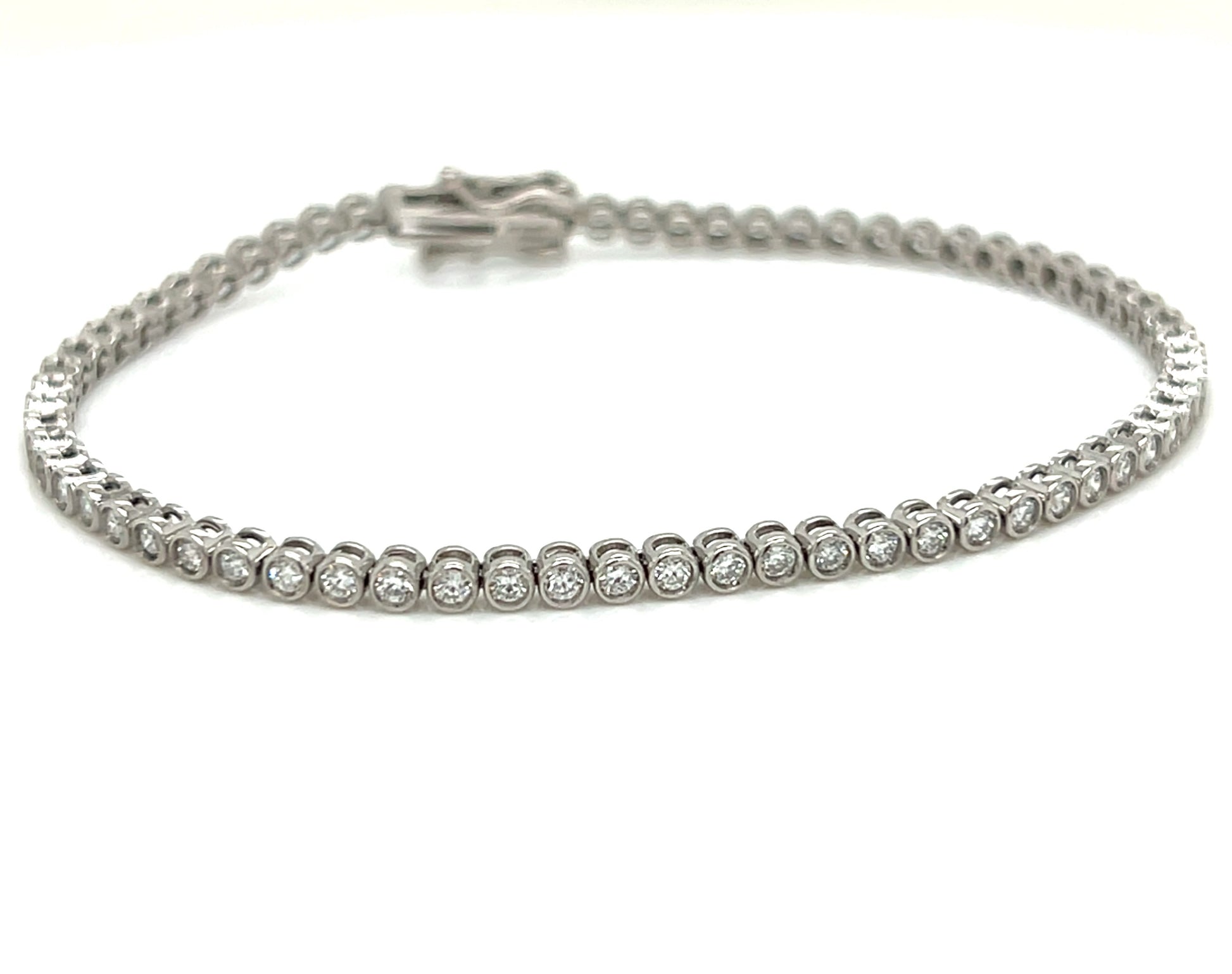 Bezel setting diamond tennis bracelet on a white background