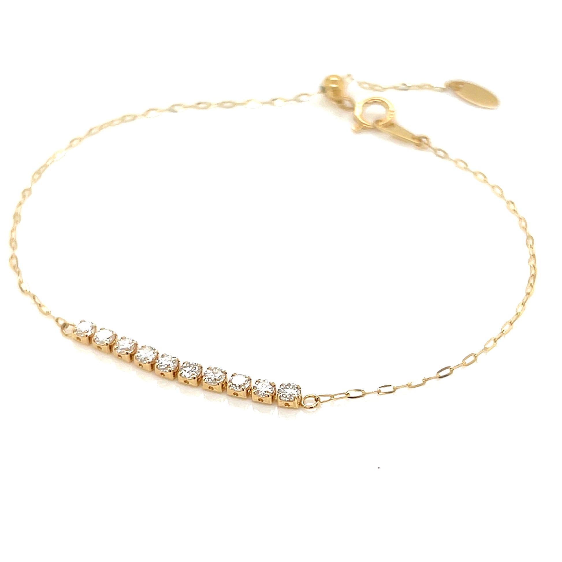 Gold bracelet with small diamonds on a white background
