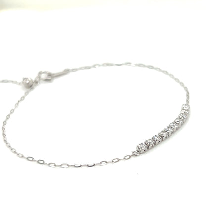 Platinum bracelet with row of diamonds on a white background