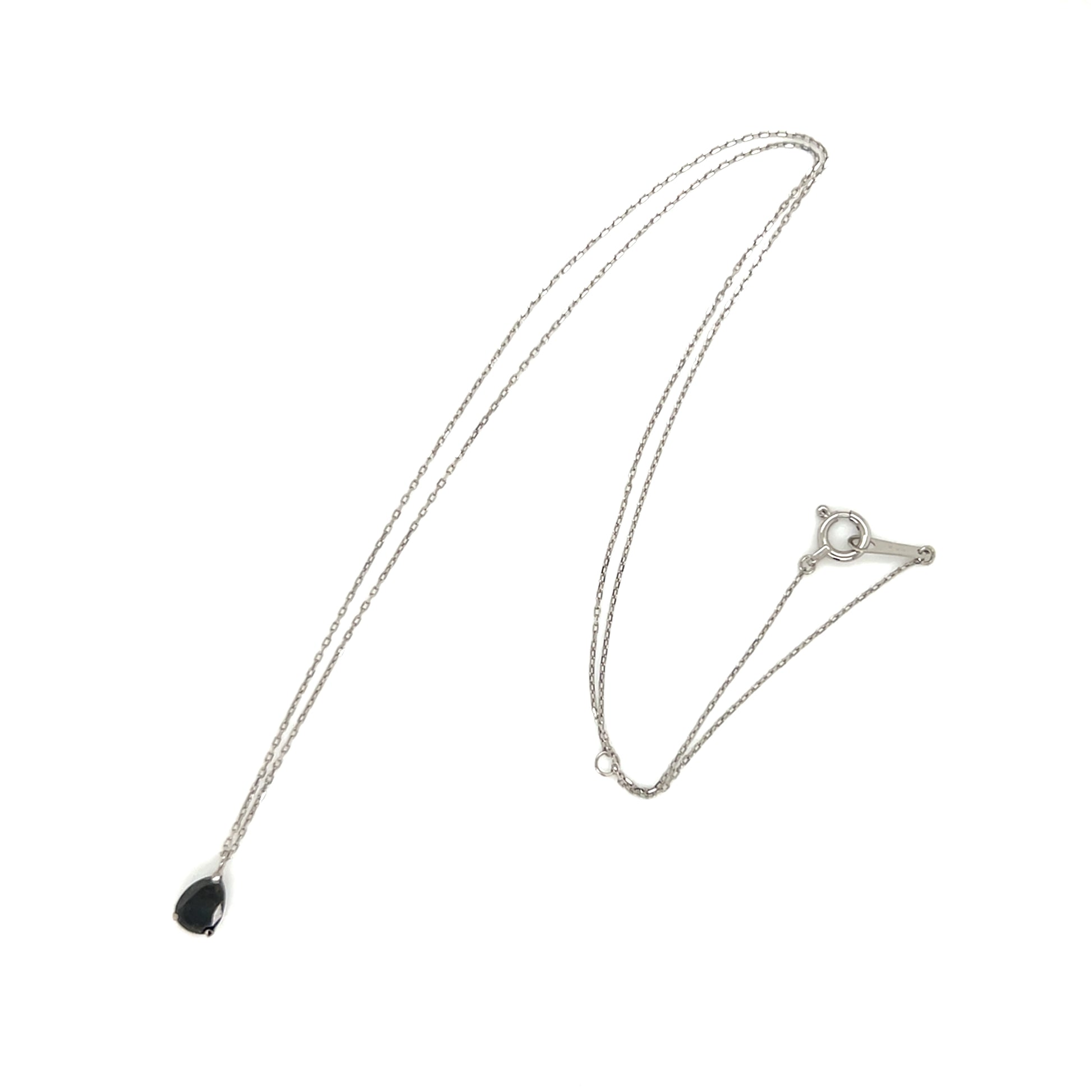 Platinum necklace with a black diamond pear shape pendant on a white background